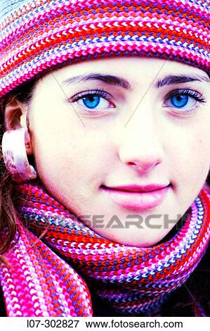 Teenager in striped hat and scarf smiling View Large Photo Image Stock Photo - Teenager in striped hat and scarf smiling. Fotosearch