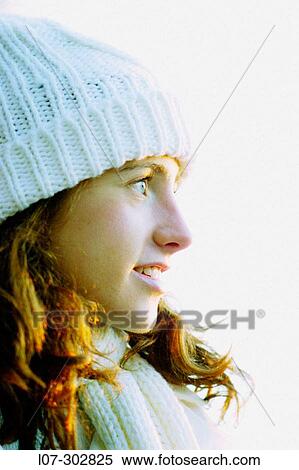 Teenager in white hat looking far away View Large Photo Image Stock Photography - Teenager in white hat looking far away. Fotosearch