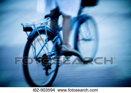 Teenager on bicycle Motion and blur View Large Photo Image Picture - Teenager on bicycle Motion and blur. Fotosearch