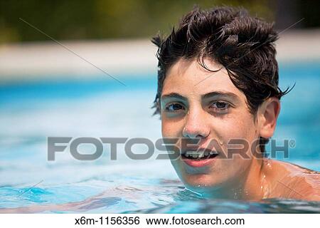 Stock Photograph - teenager portrait in a swimming pool. Fotosearch