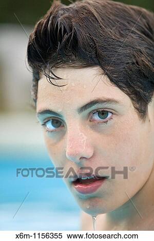 Stock Photography - teenager portrait in a swimming pool. Fotosearch