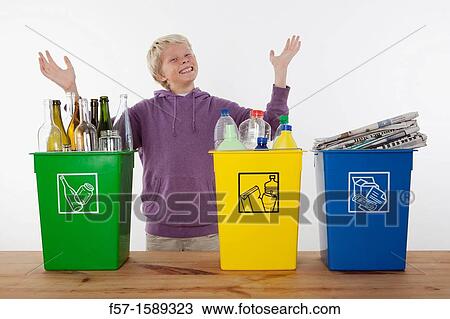 Teenager recycling domestic waste View Large Photo Image Stock Image - Teenager recycling domestic waste. Fotosearch