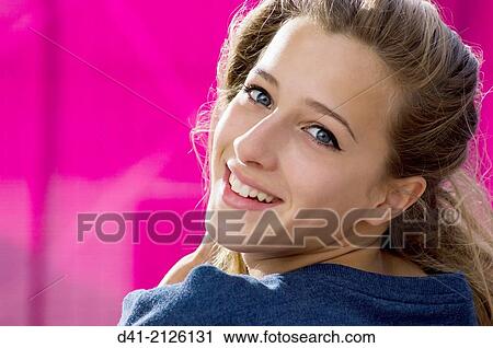 Stock Image - Teenager smiling gaily.. Fotosearch