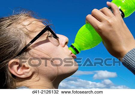 Stock Image - teenager thirsty drinking.. Fotosearch