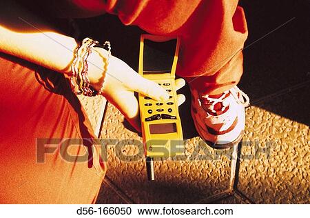 Teenager using cell phone View Large Photo Image Stock Image - Teenager using cell phone. Fotosearch