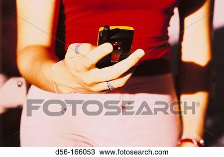 Teenager using cell phone View Large Photo Image Stock Image - Teenager using cell phone. Fotosearch