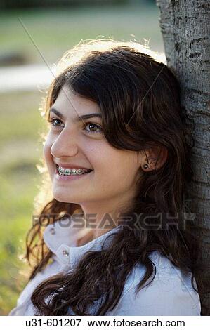 Teenager with brackets smiles View Large Photo Image Stock Photo - Teenager with brackets smiles. Fotosearch