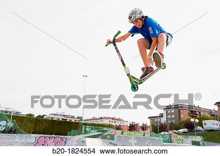 Teenager with city scooter in Skate park, Leioa, Bizkaia, Basque Country, Spain View Large Photo Image Picture - Teenager with city scooter in Skate park, Leioa, Bizkaia, Basque Country, Spain. Fotosearch