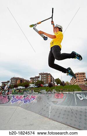 Teenager with city scooter in Skate park, Leioa, Bizkaia, Basque Country, Spain View Large Photo Image Picture - Teenager with city scooter in Skate park, Leioa, Bizkaia, Basque Country, Spain. Fotosearch