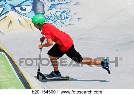 Teenager with city scooter in Skate park, Irun, Gipuzkoa, Euskadi, Spain View Large Photo Image Stock Image - Teenager with city scooter in Skate park, Irun, Gipuzkoa, Euskadi, Spain. Fotosearch