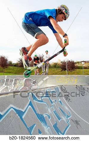 Teenager with city scooter in Skate park, Leioa, Bizkaia, Basque Country, Spain View Large Photo Image Stock Image - Teenager with city scooter in Skate park, Leioa, Bizkaia, Basque Country, Spain. Fotosearch