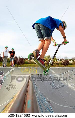Teenager with city scooter in Skate park, Leioa, Bizkaia, Basque Country, Spain View Large Photo Image Stock Image - Teenager with city scooter in Skate park, Leioa, Bizkaia, Basque Country, Spain. Fotosearch