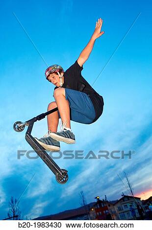 Teenager with city scooter in Skate park, Irun, Gipuzkoa, Basque country, Spain. View Large Photo Image Stock Image - Teenager with city scooter in Skate park, Irun, Gipuzkoa, Basque country, Spain.. Fotosearch