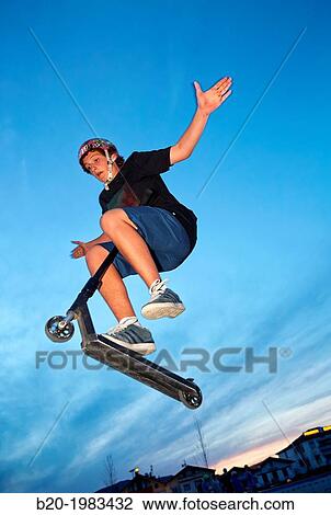 Teenager with city scooter in Skate park, Irun, Gipuzkoa, Basque country, Spain. View Large Photo Image Stock Image - Teenager with city scooter in Skate park, Irun, Gipuzkoa, Basque country, Spain.. Fotosearch