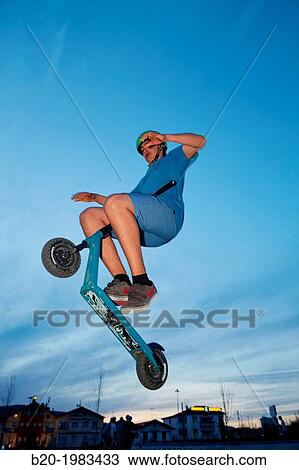 Teenager with city scooter in Skate park, Irun, Gipuzkoa, Basque country, Spain. View Large Photo Image Stock Image - Teenager with city scooter in Skate park, Irun, Gipuzkoa, Basque country, Spain.. Fotosearch