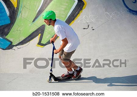 Teenager with city scooter in Skate park, Irun, Gipuzkoa, Euskadi, Spain View Large Photo Image Stock Photo - Teenager with city scooter in Skate park, Irun, Gipuzkoa, Euskadi, Spain. Fotosearch