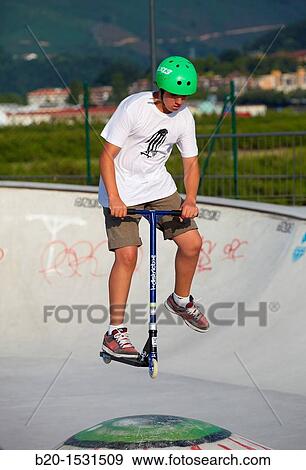 Teenager with city scooter in Skate park, Irun, Gipuzkoa, Euskadi, Spain View Large Photo Image Stock Photo - Teenager with city scooter in Skate park, Irun, Gipuzkoa, Euskadi, Spain. Fotosearch