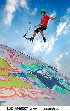 Teenager with city scooter in Skate park, Irun, Gipuzkoa, Euskadi, Spain View Large Photo Image Stock Photo - Teenager with city scooter in Skate park, Irun, Gipuzkoa, Euskadi, Spain. Fotosearch
