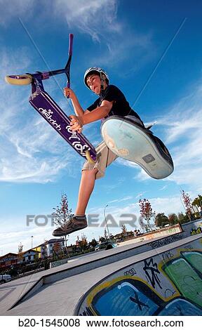 Teenager with city scooter in Skate park, Irun, Gipuzkoa, Euskadi, Spain View Large Photo Image Stock Photo - Teenager with city scooter in Skate park, Irun, Gipuzkoa, Euskadi, Spain. Fotosearch