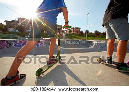 Teenager with city scooter in Skate park, Leioa, Bizkaia, Basque Country, Spain View Large Photo Image Stock Photo - Teenager with city scooter in Skate park, Leioa, Bizkaia, Basque Country, Spain. Fotosearch