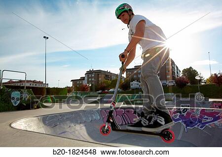 Teenager with city scooter in Skate park, Leioa, Bizkaia, Basque Country, Spain View Large Photo Image Stock Photo - Teenager with city scooter in Skate park, Leioa, Bizkaia, Basque Country, Spain. Fotosearch