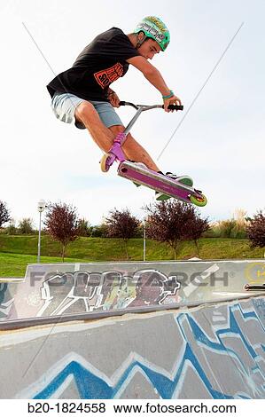Teenager with city scooter in Skate park, Leioa, Bizkaia, Basque Country, Spain View Large Photo Image Stock Photo - Teenager with city scooter in Skate park, Leioa, Bizkaia, Basque Country, Spain. Fotosearch
