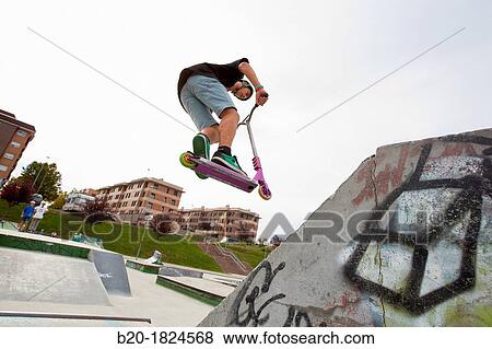 Teenager with city scooter in Skate park, Leioa, Bizkaia, Basque Country, Spain View Large Photo Image Stock Photo - Teenager with city scooter in Skate park, Leioa, Bizkaia, Basque Country, Spain. Fotosearch