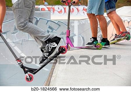 Teenager with city scooter in Skate park, Leioa, Bizkaia, Basque Country, Spain View Large Photo Image Stock Photograph - Teenager with city scooter in Skate park, Leioa, Bizkaia, Basque Country, Spain. Fotosearch
