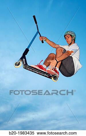 Teenager with city scooter in Skate park, Irun, Gipuzkoa, Basque country, Spain. View Large Photo Image Stock Photography - Teenager with city scooter in Skate park, Irun, Gipuzkoa, Basque country, Spain.. Fotosearch