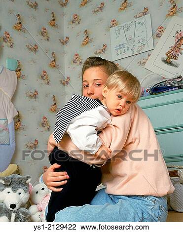 Teenager with her Little Sister. View Large Photo Image Stock Image - Teenager with her Little Sister.. Fotosearch