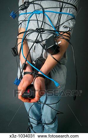 Teenager with long hair tied up with computer cables View Large Photo Image Stock Image - Teenager with long hair tied up with computer cables. Fotosearch