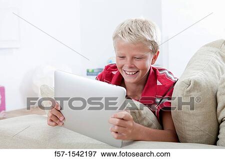 Stock Photo - Teenager with Tablet. Fotosearch