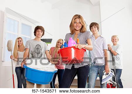 Teenagers doing housework View Large Photo Image Stock Image - Teenagers doing housework. Fotosearch