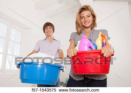 Teenagers doing housework View Large Photo Image Stock Photography - Teenagers doing housework. Fotosearch
