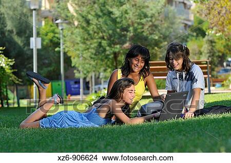 Picture - teenagers in the park. Fotosearch