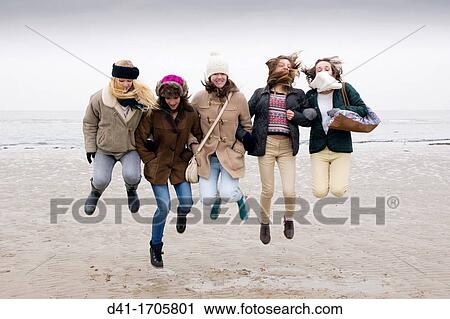 Teenagers jumping on Margate, Kent beach View Large Photo Image Stock Image - Teenagers jumping on Margate, Kent beach. Fotosearch