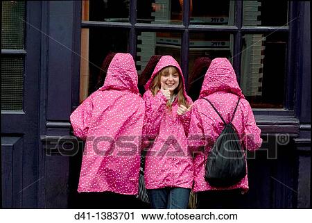teenagers pink raincoats trio View Large Photo Image Stock Image - teenagers pink raincoats trio. Fotosearch