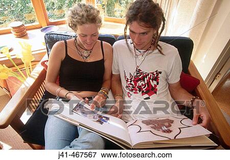 Teenagers reading. Boyfriend and girlfriend in family home. Christchurch, Canterbury. New Zealand. View Large Photo Image Stock Photo - Teenagers reading. Boyfriend and girlfriend in family home. Christchurch, Canterbury. New Zealand.. Fotosearch