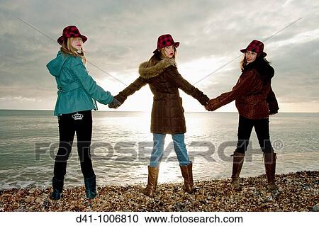 Stock Image - teenagers silhouette brighton. Fotosearch