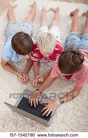 Teenagers surfing the net View Large Photo Image Stock Image - Teenagers surfing the net. Fotosearch