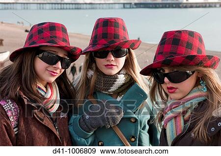 Stock Photo - teenagers tartan hats. Fotosearch
