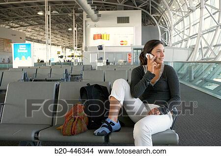 Teengirl using cell phone in Brussels airport. Belgium View Large Photo Image Picture - Teengirl using cell phone in Brussels airport. Belgium. Fotosearch