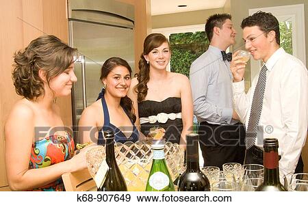 Stock Photo - Teens at graduation party. Fotosearch