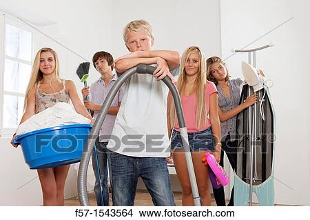 Teens bored with housework View Large Photo Image Picture - Teens bored with housework. Fotosearch