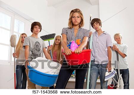 Stock Photo - Teens bored with housework. Fotosearch