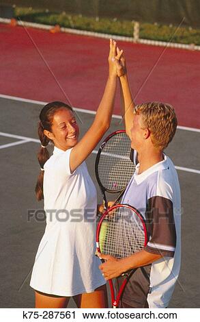 teens doing a high five at tennis match View Large Photo Image Stock Image - teens doing a high five at tennis match. Fotosearch