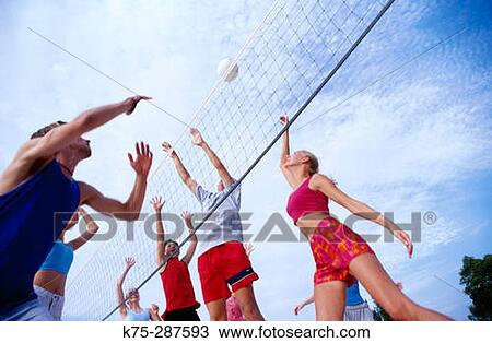 teens playing beach volleyball View Large Photo Image Stock Image - teens playing beach volleyball. Fotosearch
