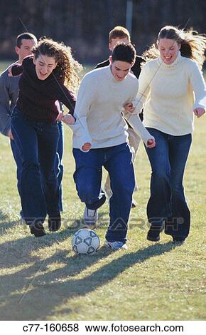 Teens playing soccer View Large Photo Image Stock Photo - Teens playing soccer. Fotosearch