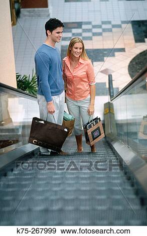 Teens shopping in mall View Large Photo Image Stock Photo - Teens shopping in mall. Fotosearch