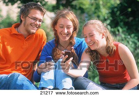 Teens with cell phones, Sweden View Large Photo Image Stock Photo - Teens with cell phones, Sweden. Fotosearch
